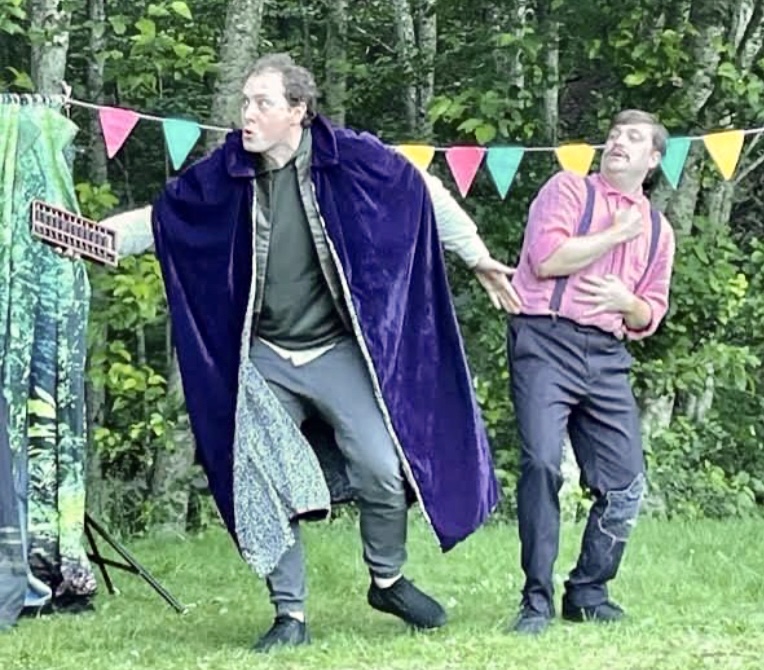Actors performing an outdoor musical play on Cates Hill. 